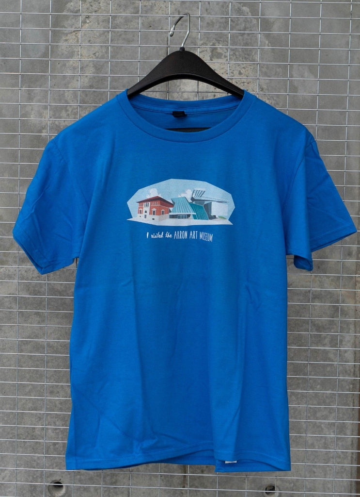 This unisex youth T-shirt features a fun, Akron Art Museum graphic designed by Akron artist Julie Arnold.  An Akron Art Museum logo is printed in white at the back of the collar.